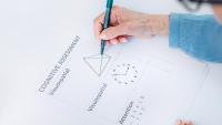 Elderly woman completes neuropsychology evaluation test.